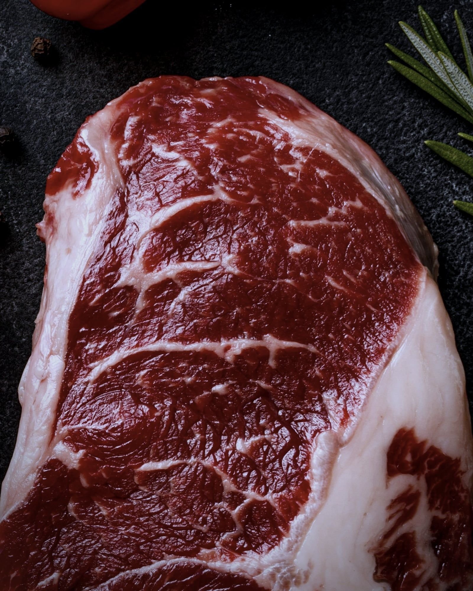 Beef, studio, on brushed steel, overhead